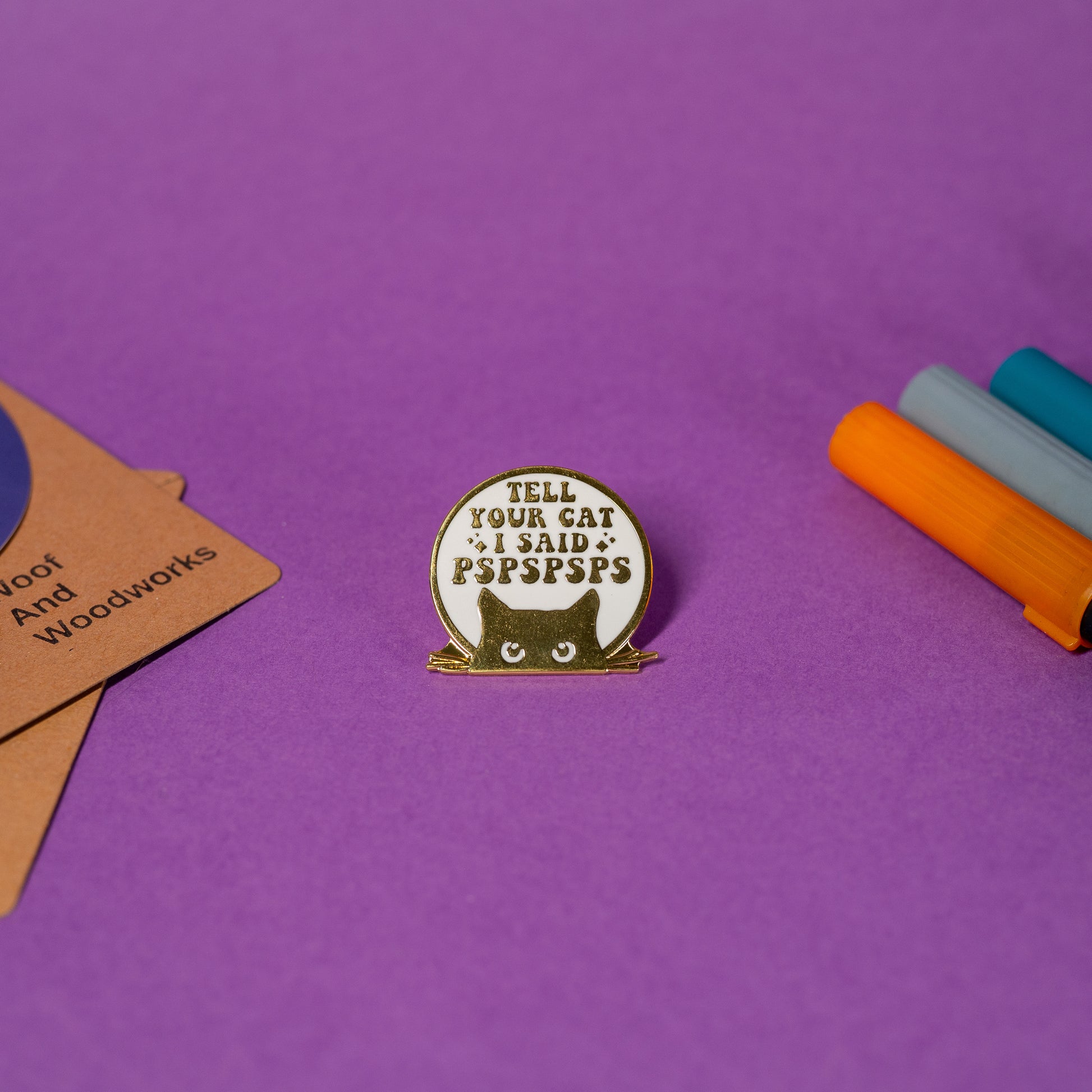 Funny cat enamel pin in white and gold design with cheeky text Tell Your Cat I Said PSPSPSPS.