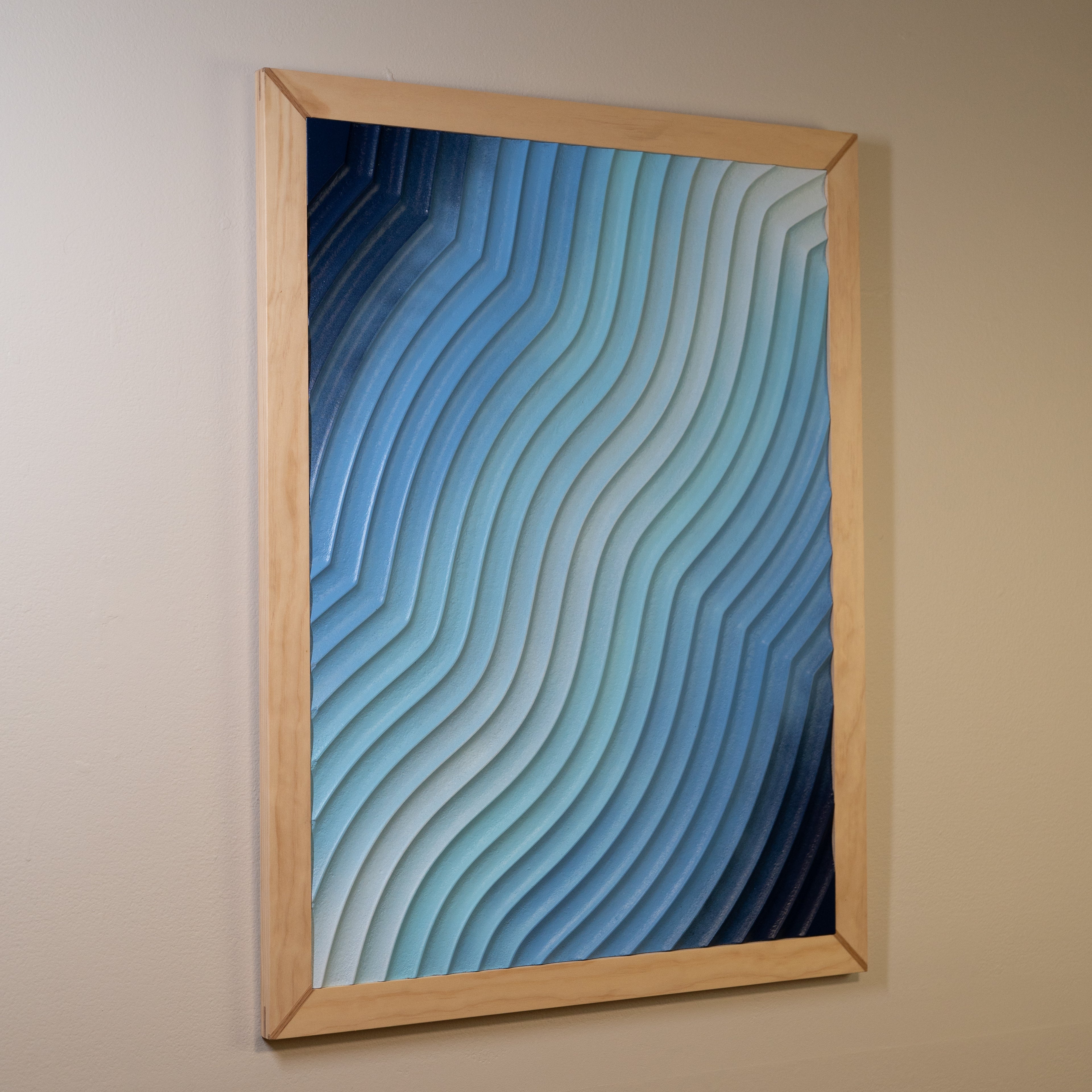 Side-angled view of "Eventide Loop" wall art, highlighting its carved texture and natural wood frame.