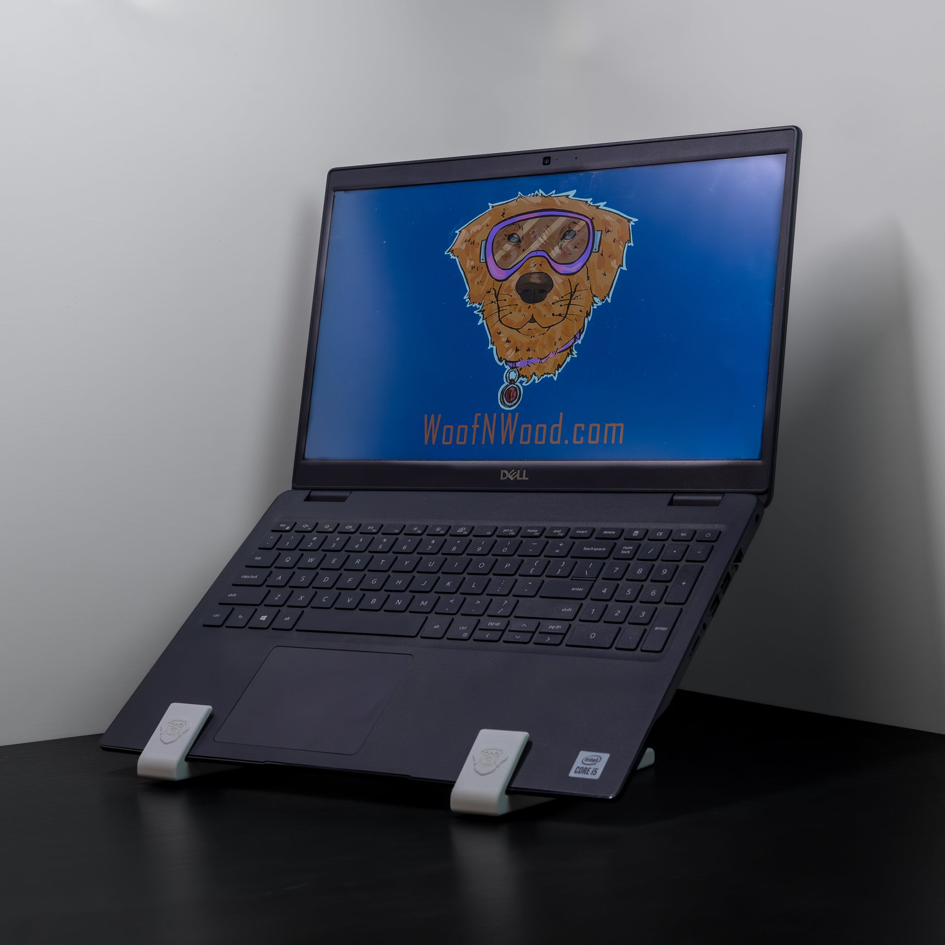 3D printed laptop stand with laptop displayed at 45-degree angle