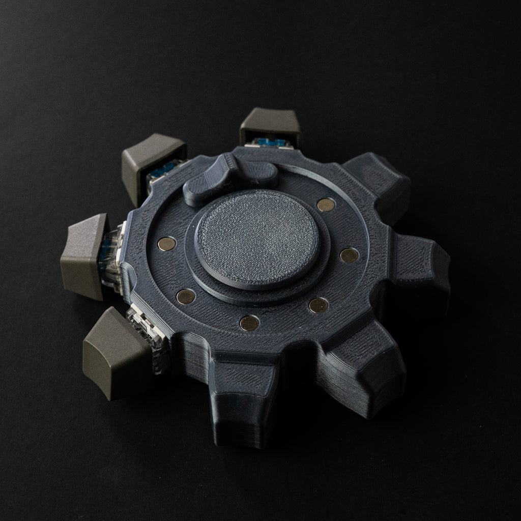 Mechanical gear fidget spinner in dark industrial style with textured center and click modules on black background.