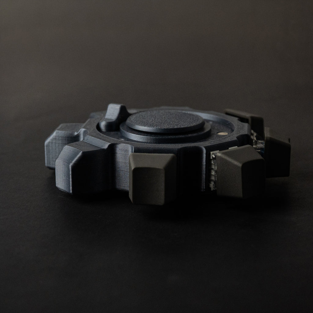 Side profile of industrial gear fidget spinner showing thickness and click module design.