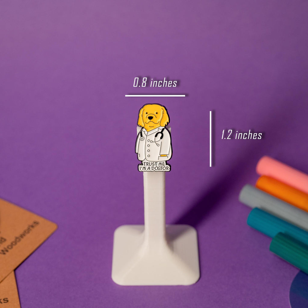 Golden retriever enamel pin featuring a dog in a doctor’s coat with the text Trust me, I’m a Dogtor.