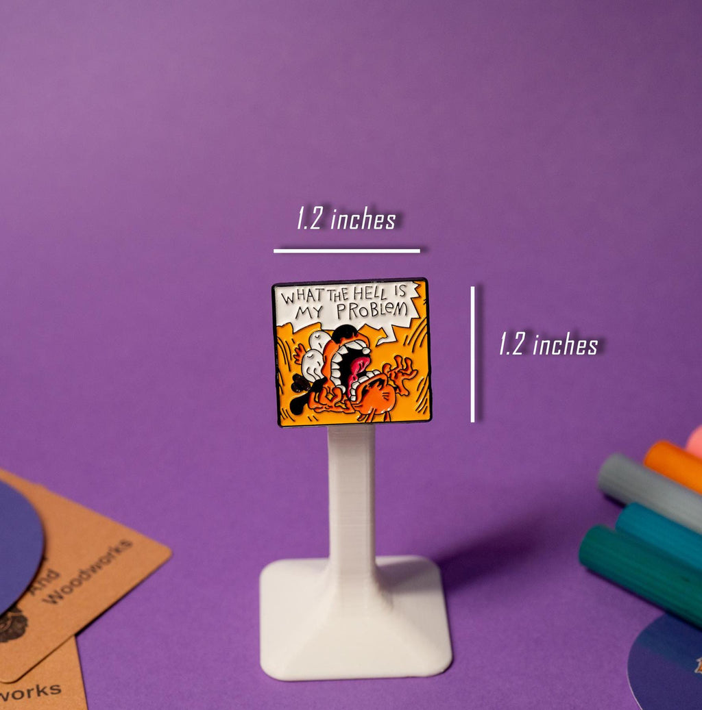 Funny enamel pin of the This Is Fine meme, displayed on a stand, ideal for quirky and relatable accessories.