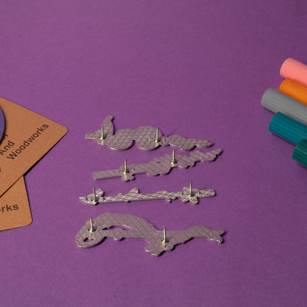 Set of Demon Slayer enamel pins featuring swords with Water, Flame, Serpent, and Insect Breathing styles.