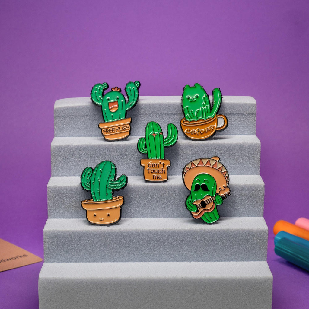 Complete collection of cute cactus enamel pins showcasing playful and humorous designs for plant lovers.