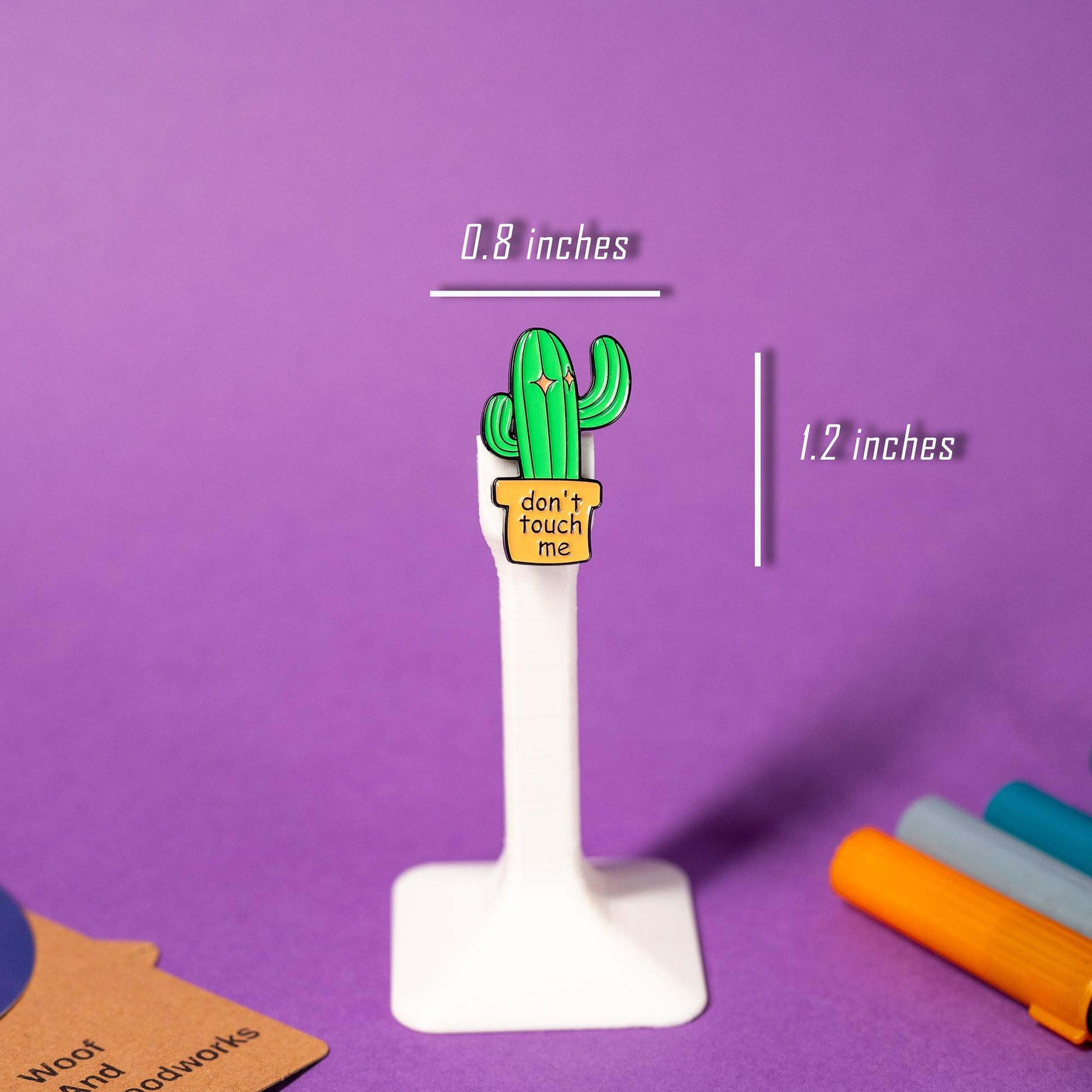Sassy cactus enamel pin with bold text Don’t Touch Me, ideal for quirky collections.