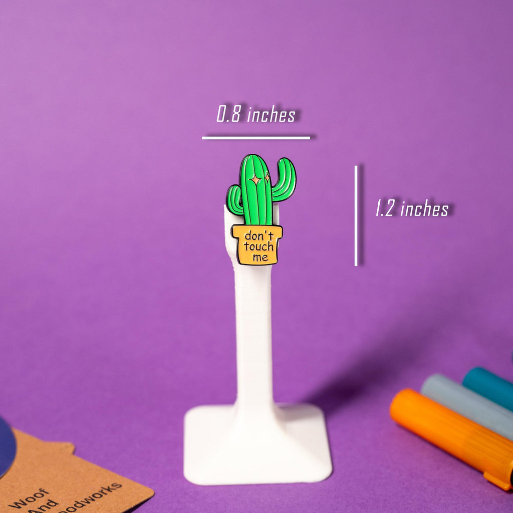 Sassy cactus enamel pin with bold text Don’t Touch Me, ideal for quirky collections.