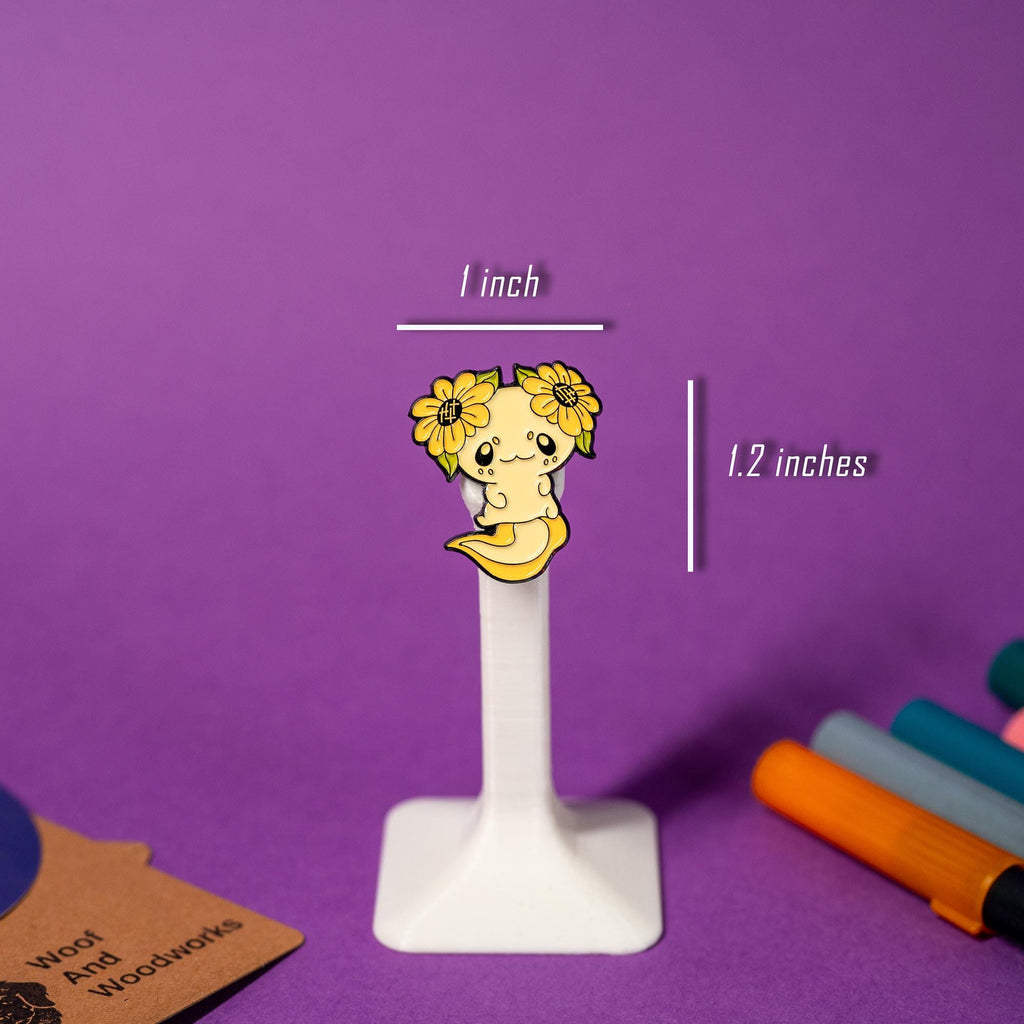 Hard enamel pin of an axolotl with colorful details, ideal for animal lovers.