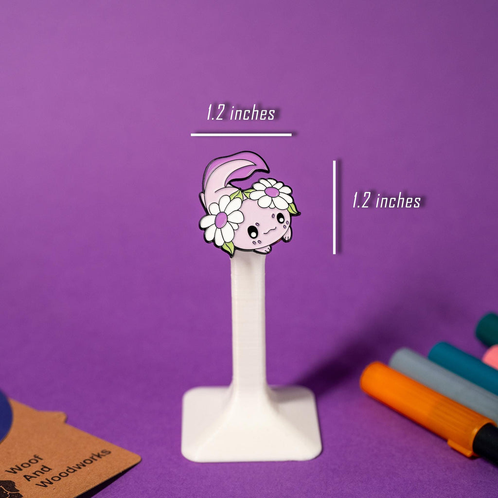 Cute enamel pin inspired by axolotls and their salamander relatives, designed in kawaii style.
