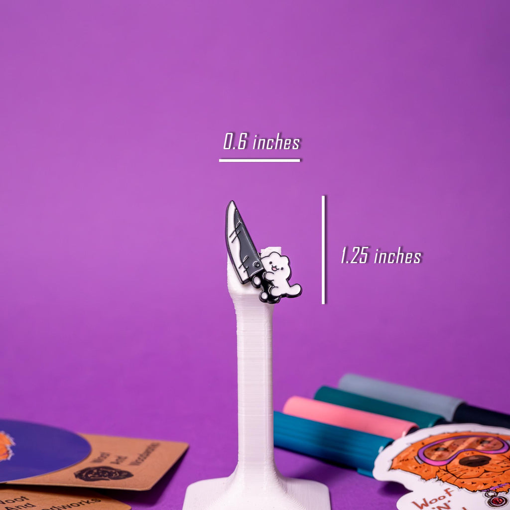 Close-up of the Knife Cat enamel pin, highlighting its funny and detailed design of a cat with a knife, a perfect accessory for pin collectors.