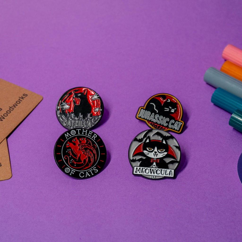 Complete collection of cat enamel pins blending humorous cat designs with iconic pop culture references.