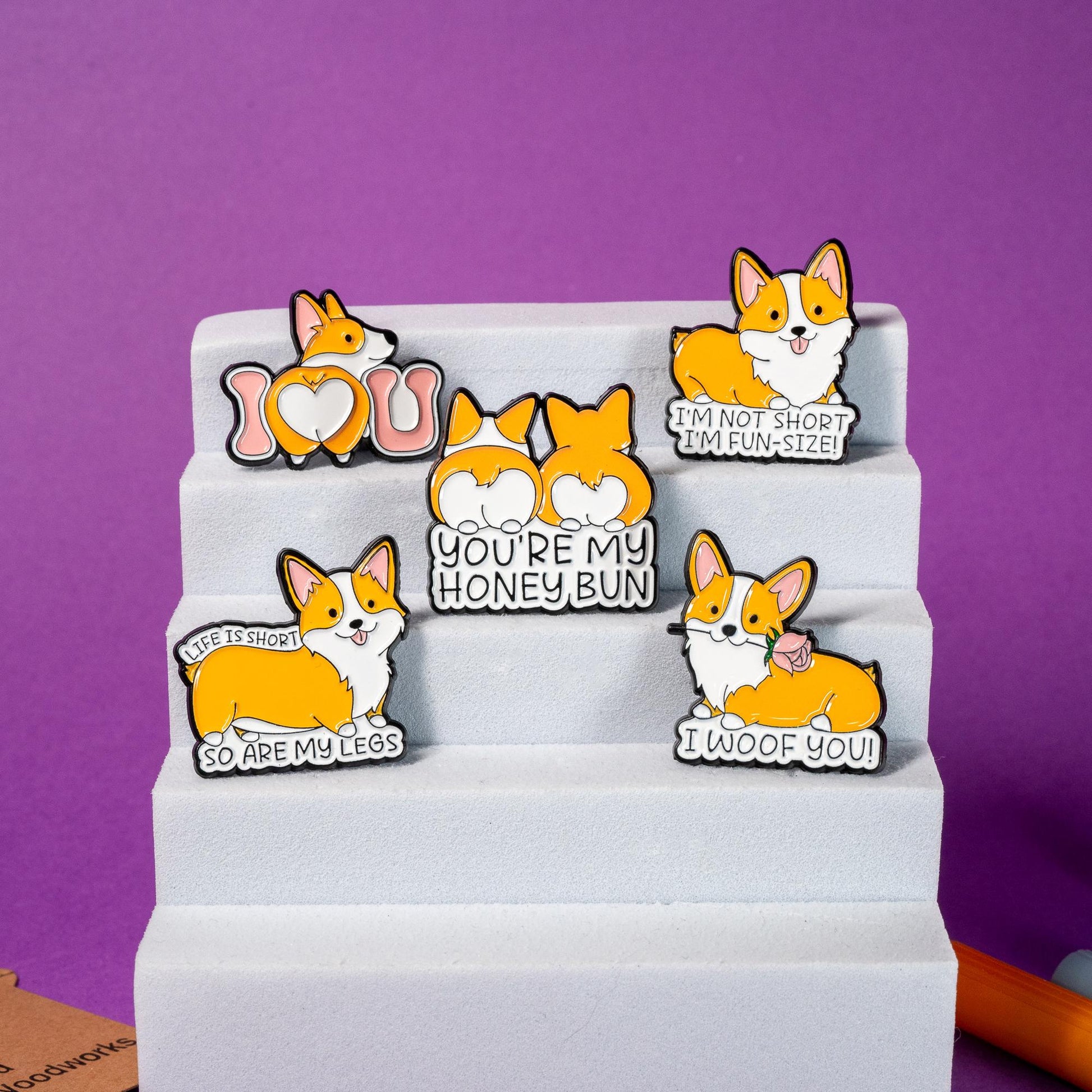 Complete collection of corgi enamel pins with vibrant colors and playful phrases, perfect for dog lovers.