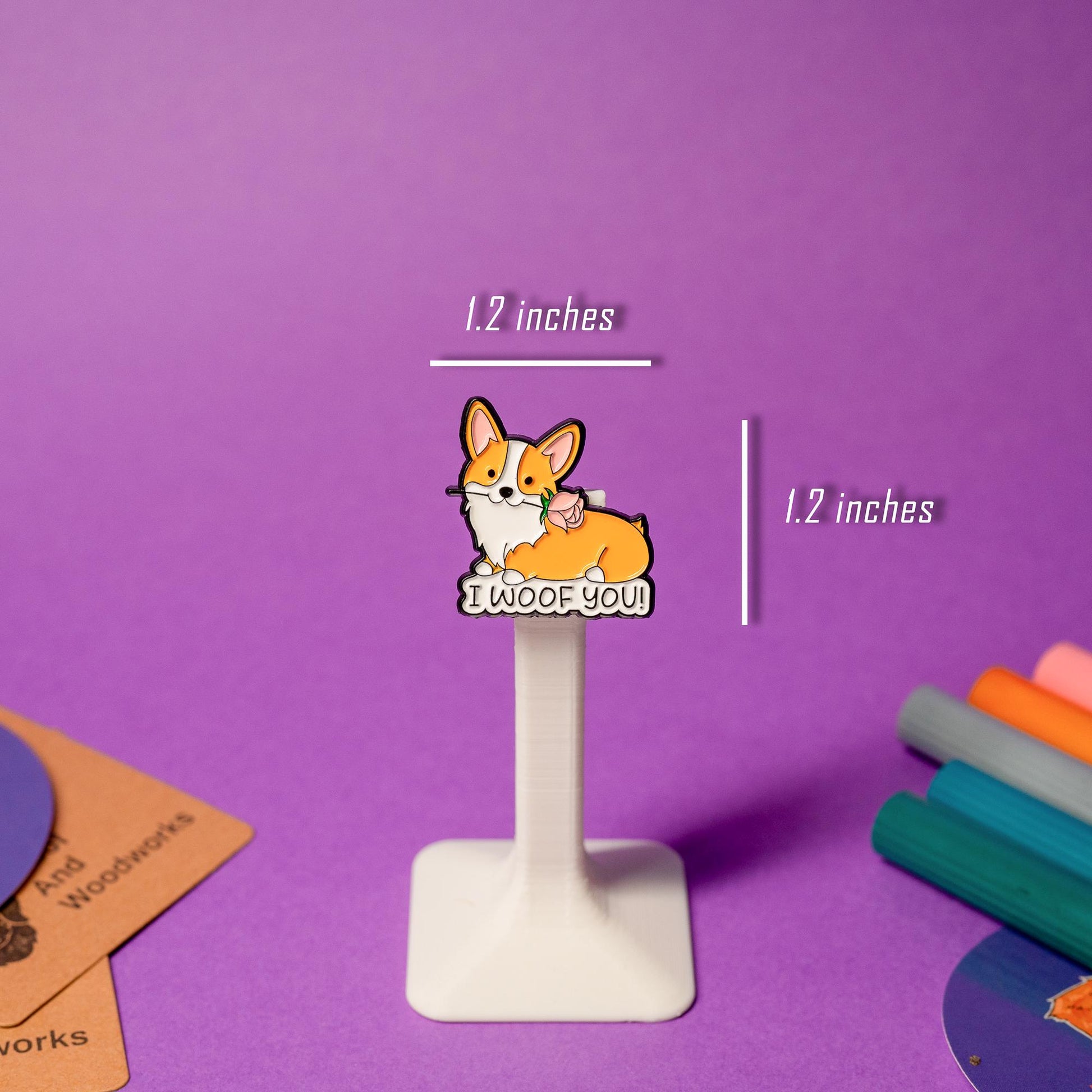 Enamel pin featuring a corgi holding a rose with the text I Woof You, perfect for dog lovers.