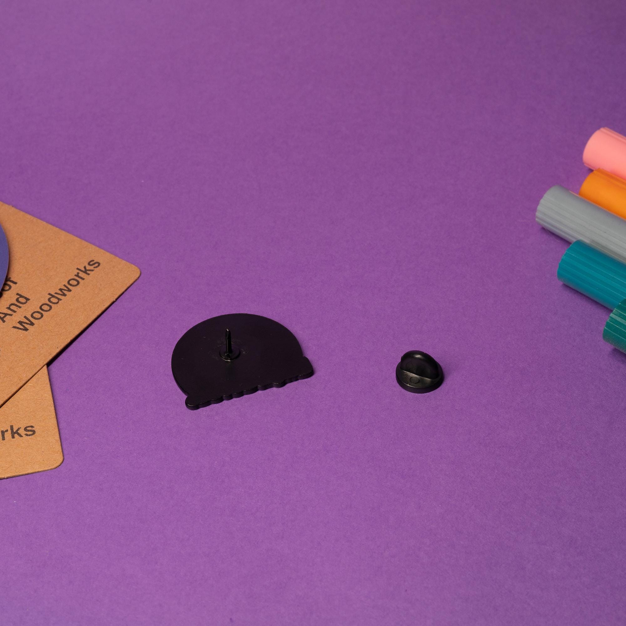 Close-up of black cat enamel pin with the sarcastic text Ew, People perfect for introverts.