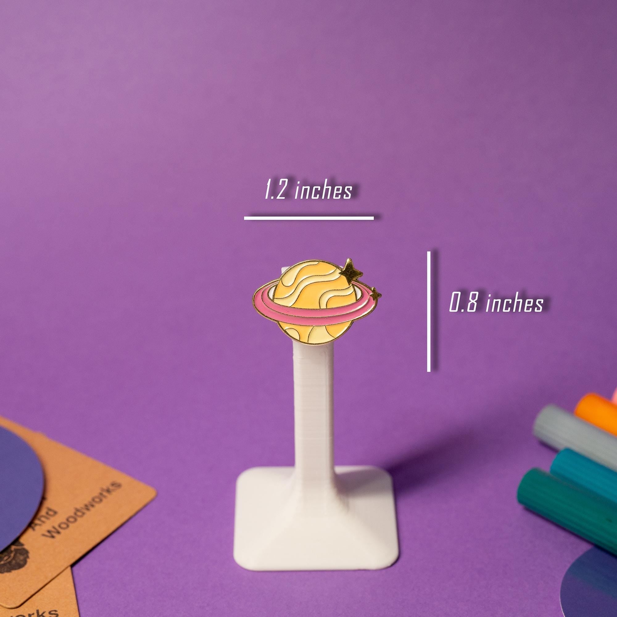 Close-up of a single planet enamel pin from the fantasy galaxy-inspired set, showcasing vibrant colors.