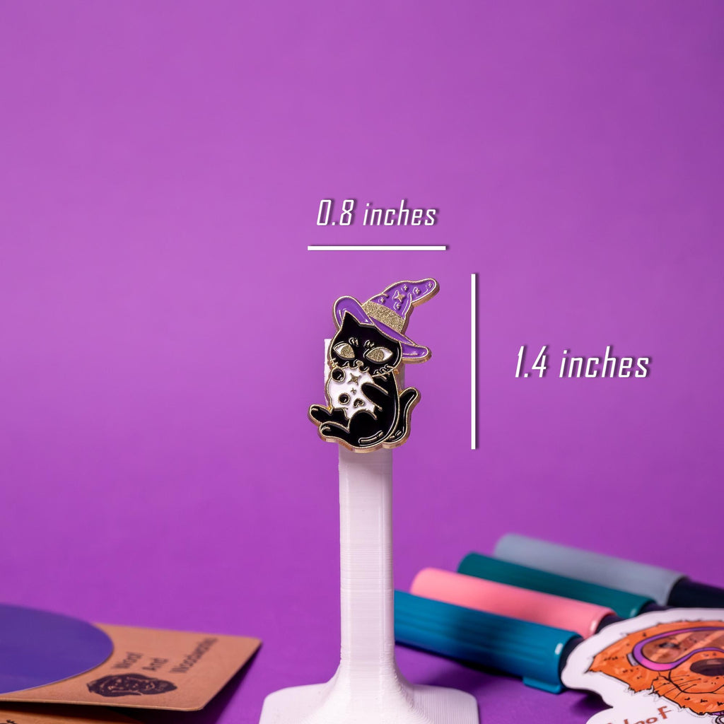 Close-up of a black-and-gold cat wearing a purple witch hat and holding a skull, ideal for mystical collectors.