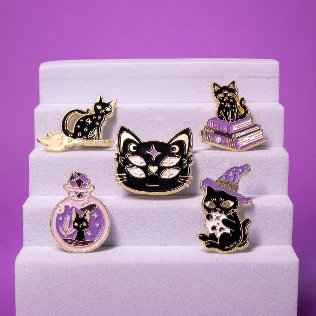 Full set of Magic Cat enamel pins arranged on a foam display stand, highlighting their vibrant details and cohesive theme.