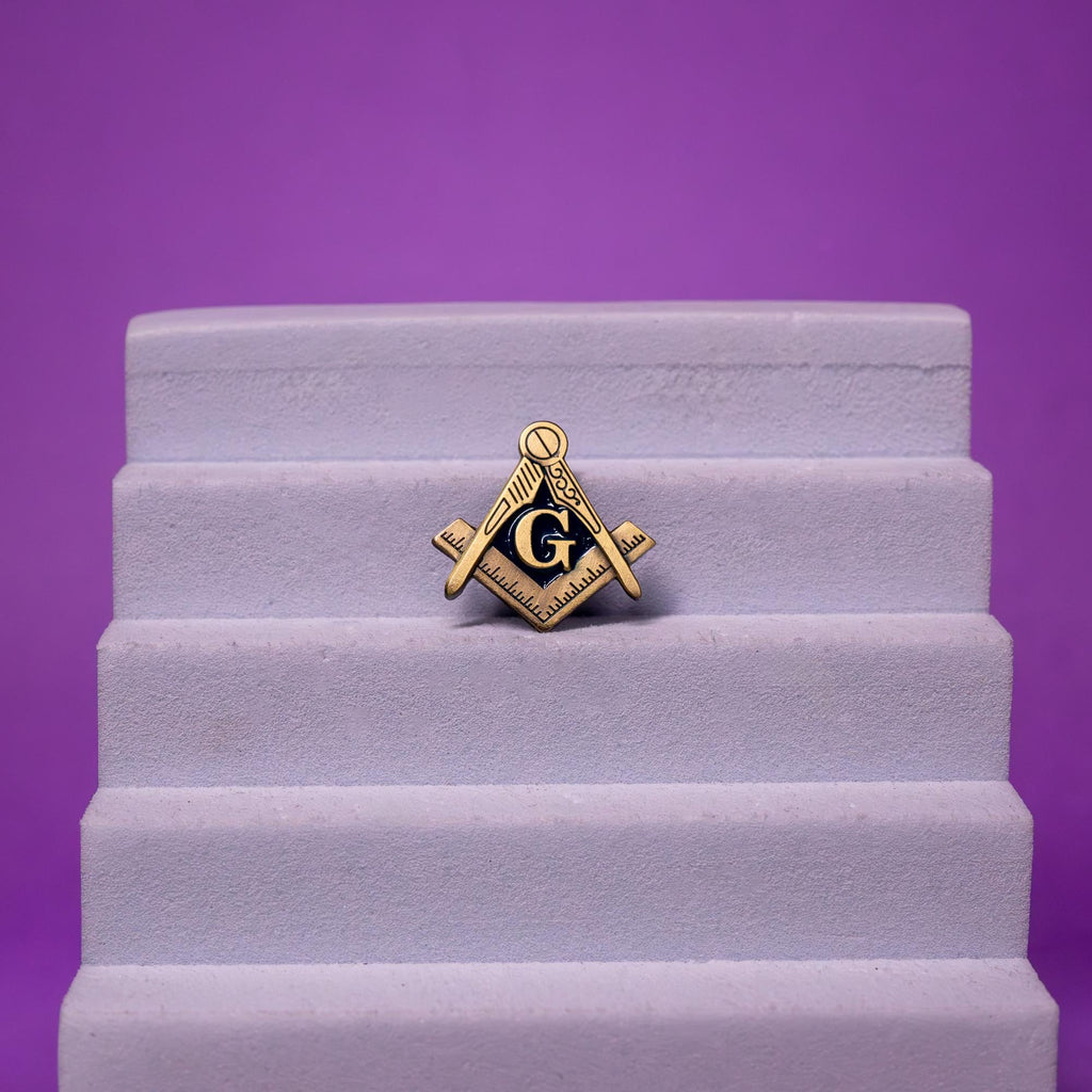 Freemason enamel pin displayed on a foam stand, emphasizing its high-quality craftsmanship and timeless Masonic symbol.