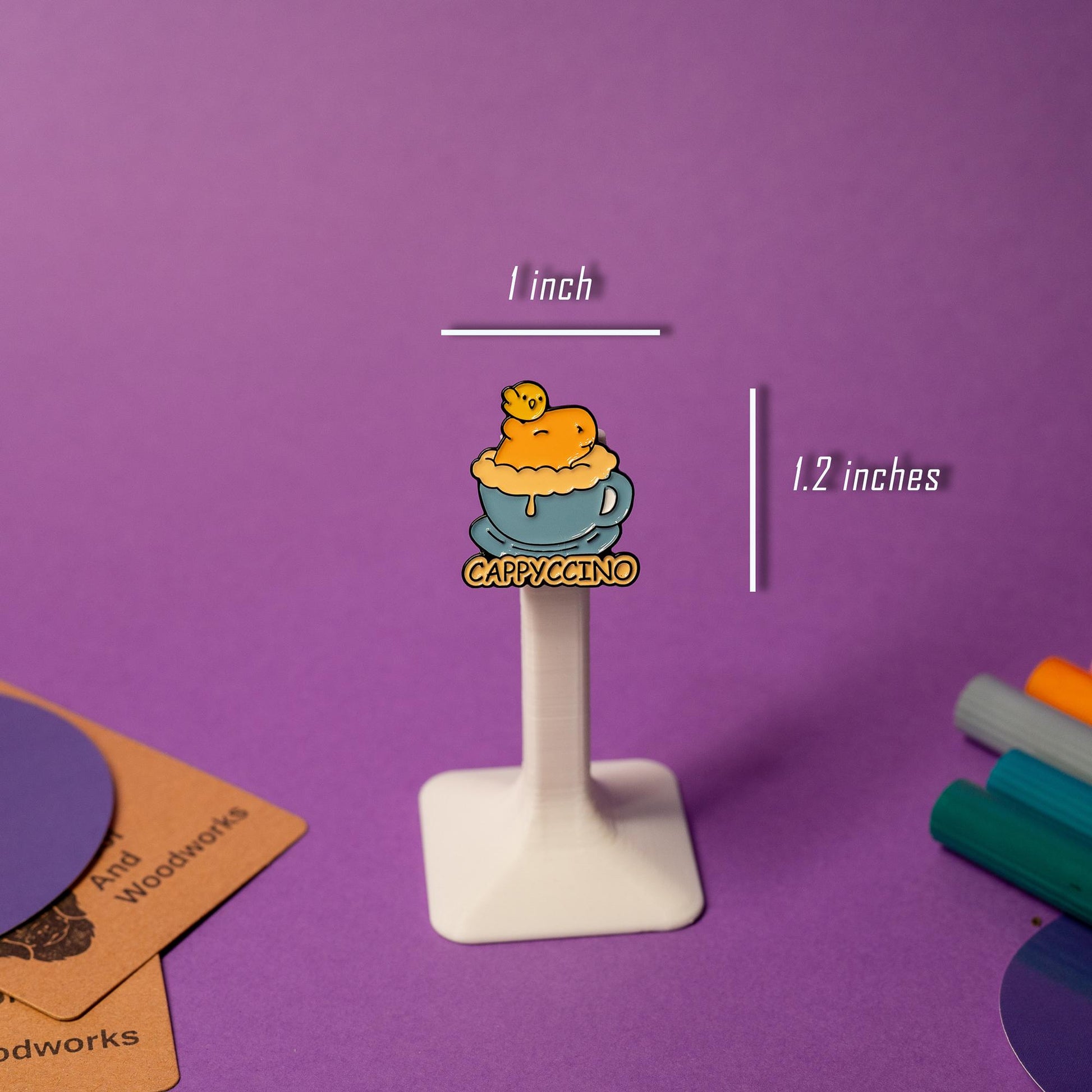 Close-up of the Cappyccino enamel pin, showcasing a capybara with coffee-inspired details for caffeine and capybara lovers.